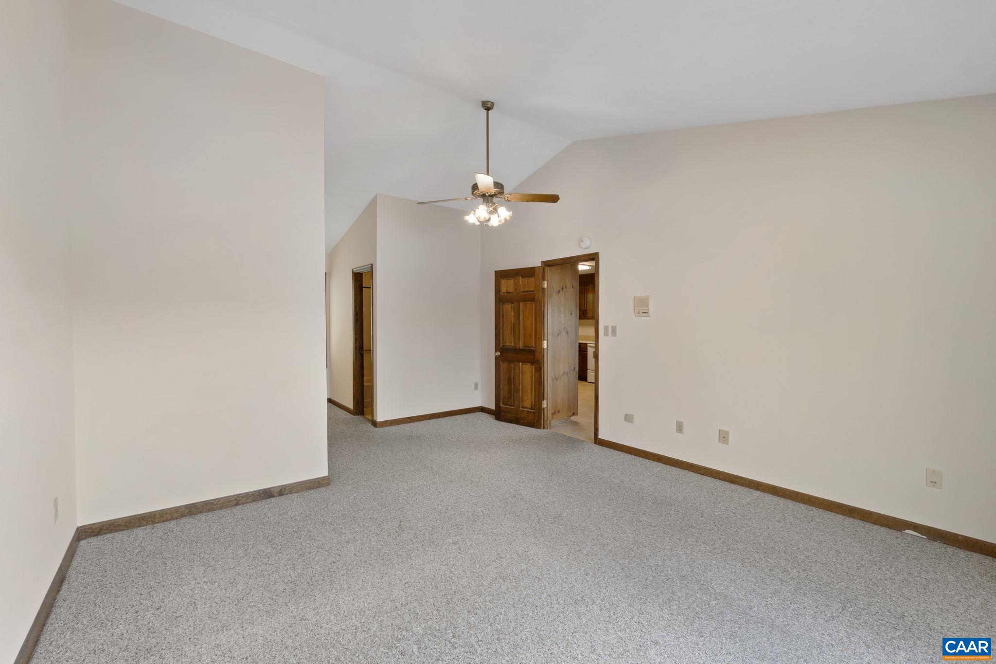 43 Tanglewood Road Palmyra, VA 22963 - Photo 28 of 64 an empty room with closet and a chandelier fan