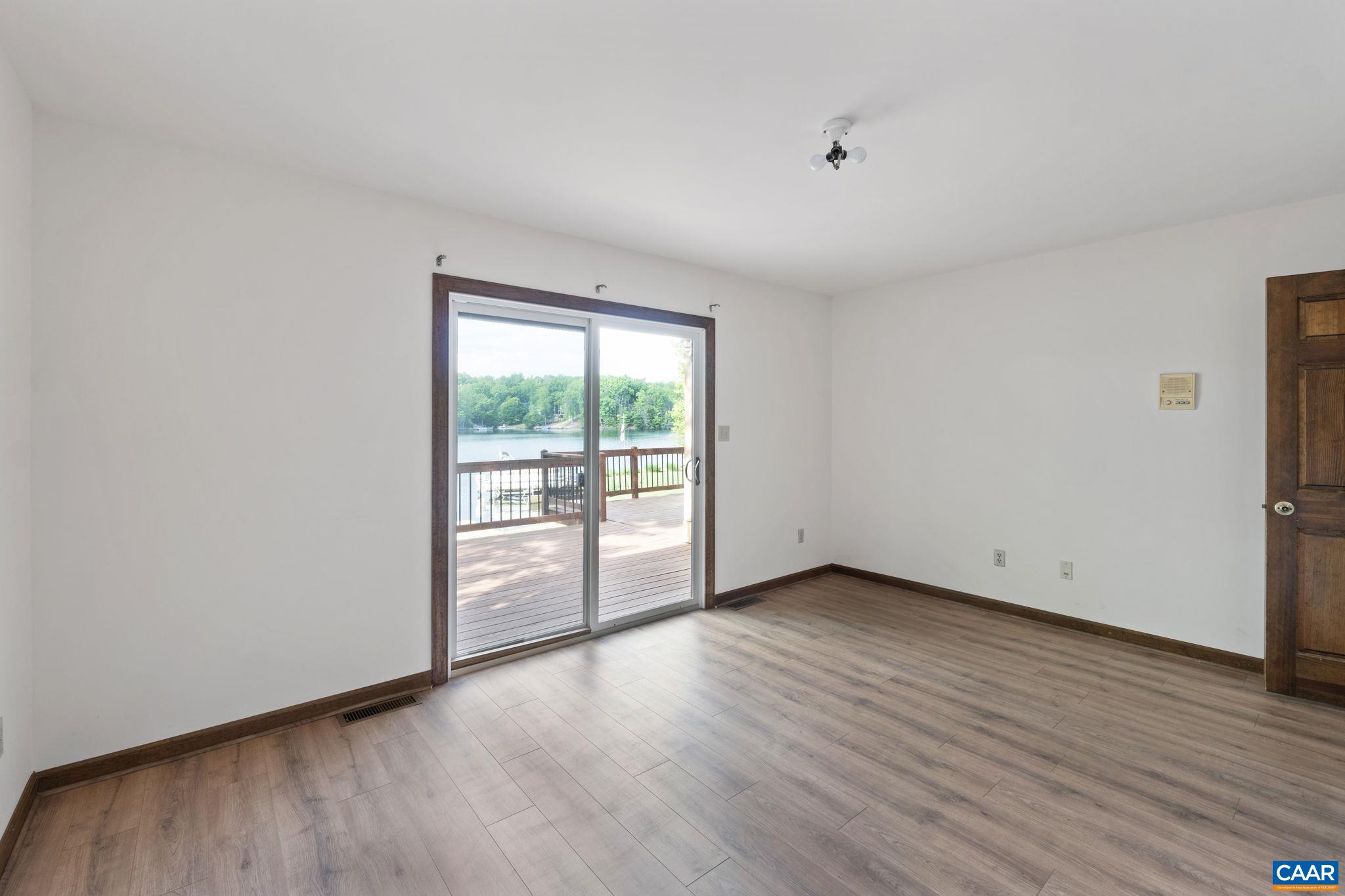 43 Tanglewood Road Palmyra, VA 22963 - Photo 32 of 64 a view of an empty room with wooden floor and a window