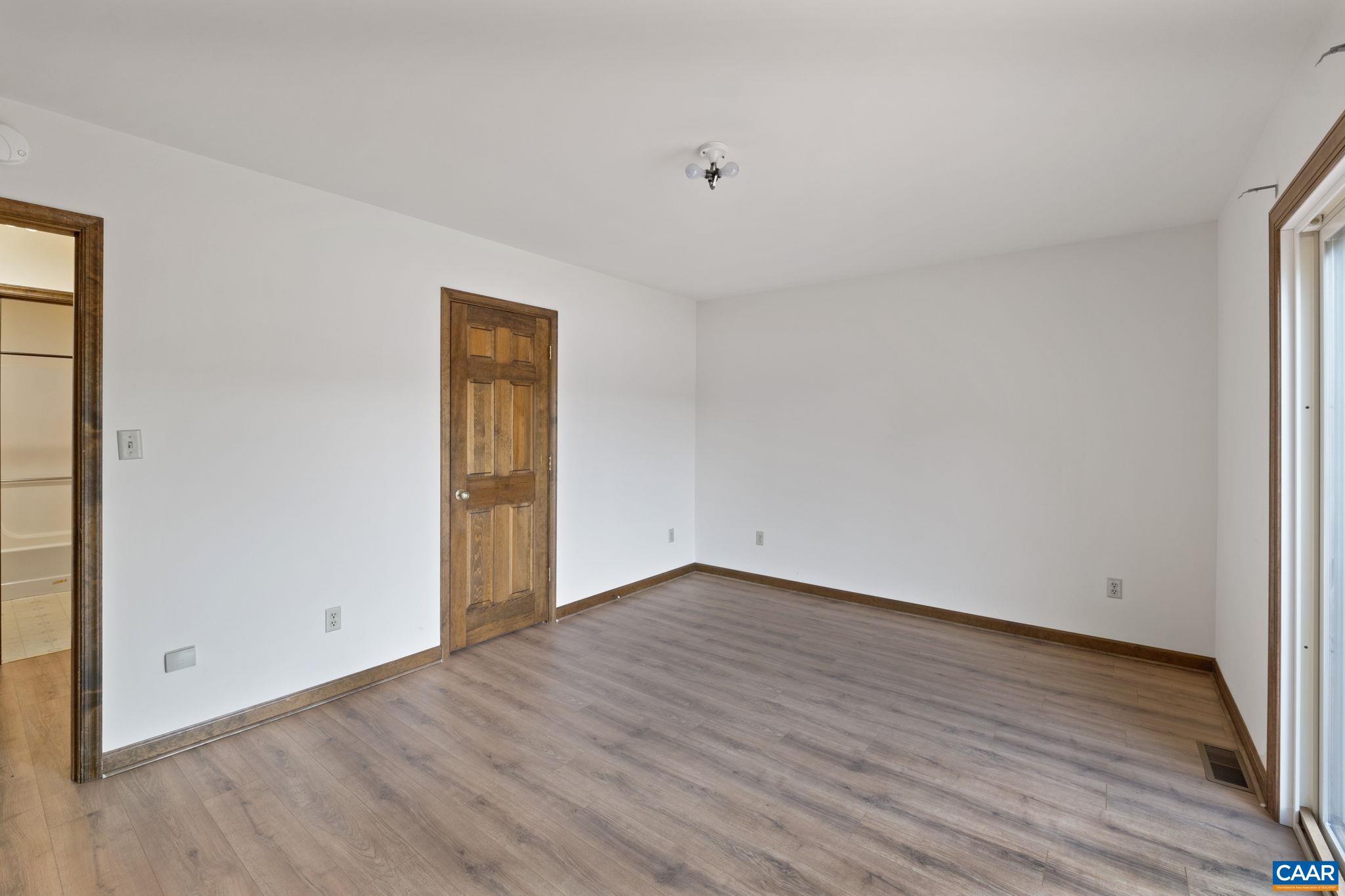 43 Tanglewood Road Palmyra, VA 22963 - Photo 34 of 64 a view of an empty room with wooden floor and a window