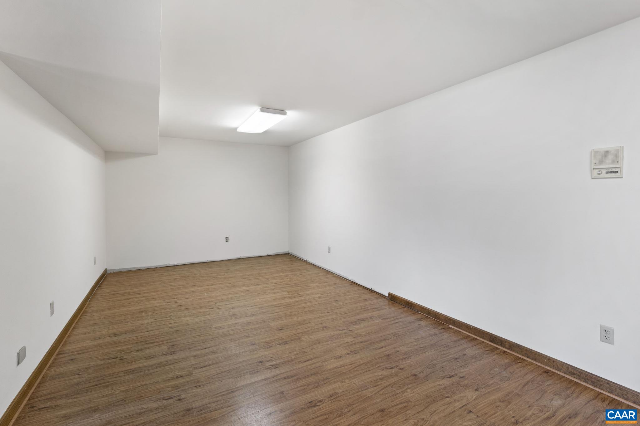 43 Tanglewood Road Palmyra, VA 22963 - Photo 42 of 64 a view of an empty room with wooden floor