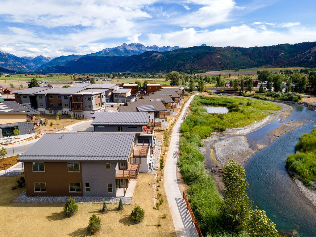 199 Riverfront Lane, Unit 201 M1A 201 Ridgway, CO 81432 - Photo 11 of 30 a view of a house with a swimming pool