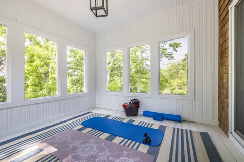 a bedroom with furniture and a window