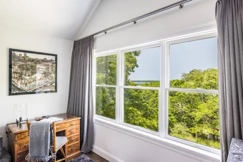 a room with bed and a window