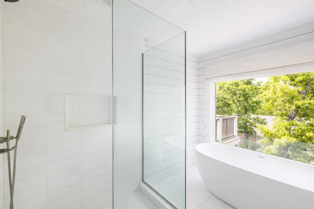 a bathroom with a bathtub and window
