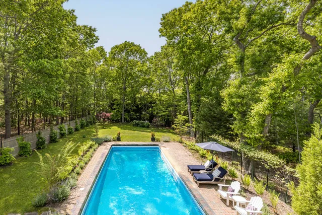 a view of swimming pool with seating area