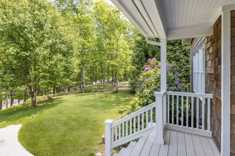 a view of a swimming pool with a porch