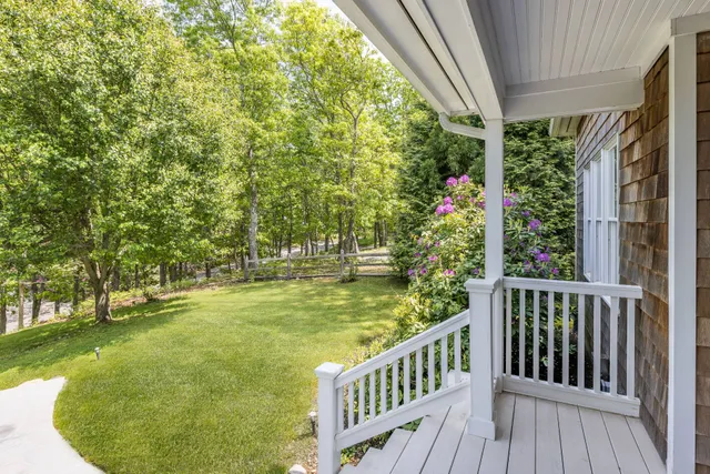 a view of a swimming pool with a porch