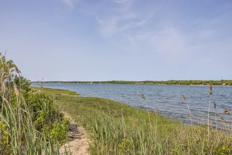 a view of a lake with a city
