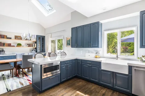 a kitchen with a sink and cabinets