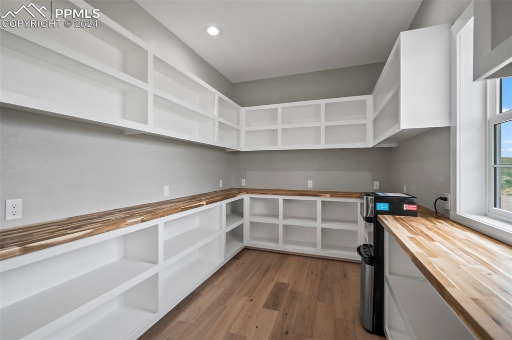 18775 Sweet Road Peyton, CO 80831 - Photo 11 of 50 a kitchen with wooden floor and electronic appliances
