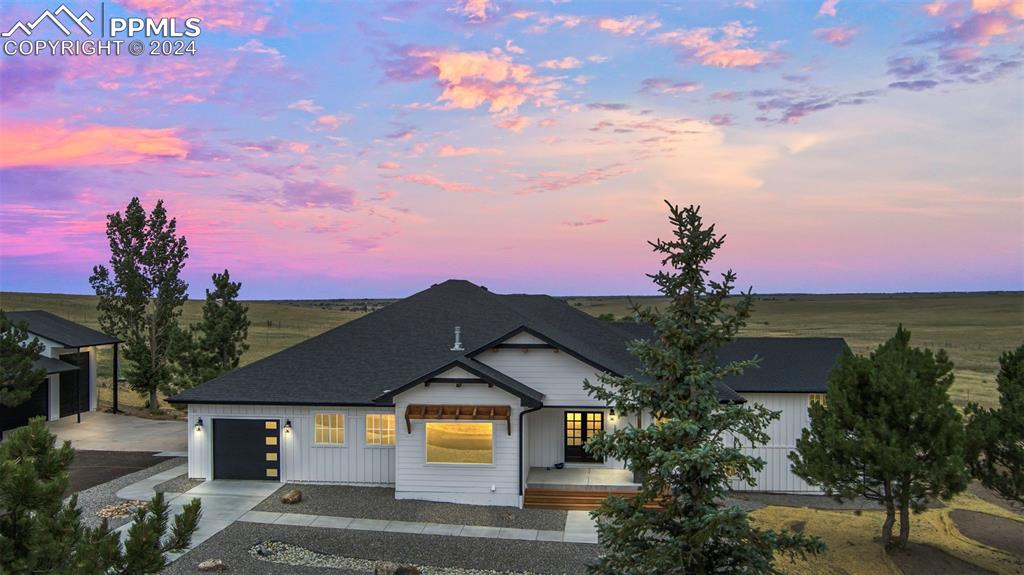 18775 Sweet Road Peyton, CO 80831 - Photo 2 of 50 a front view of a house with a yard