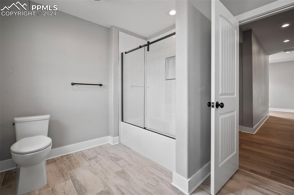 18775 Sweet Road Peyton, CO 80831 - Photo 22 of 50 a bathroom with a toilet and a shower