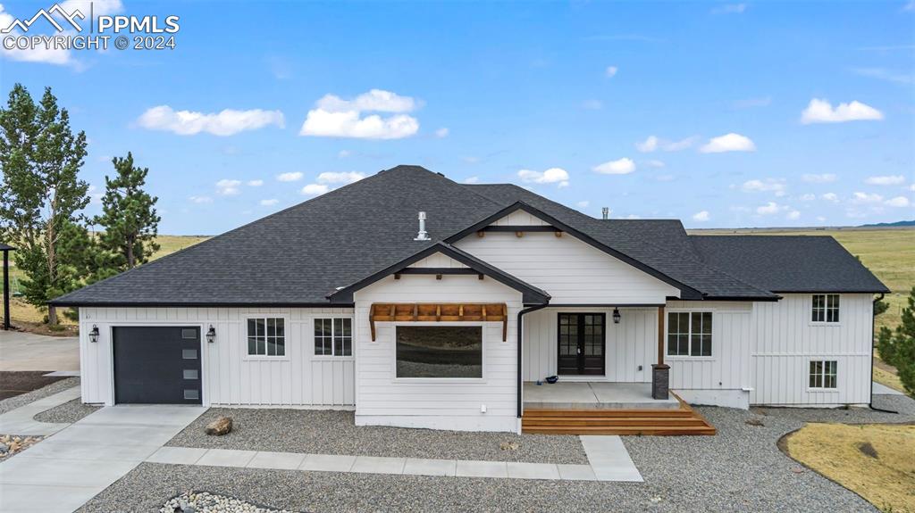 18775 Sweet Road Peyton, CO 80831 - Photo 3 of 50 a front view of a house with a yard