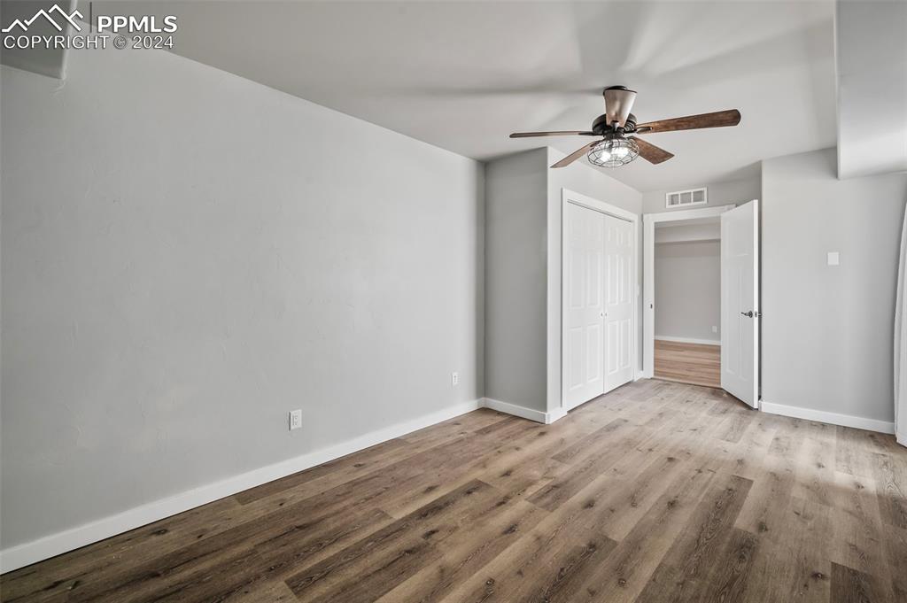 18775 Sweet Road Peyton, CO 80831 - Photo 32 of 50 a view of empty room with wooden floor