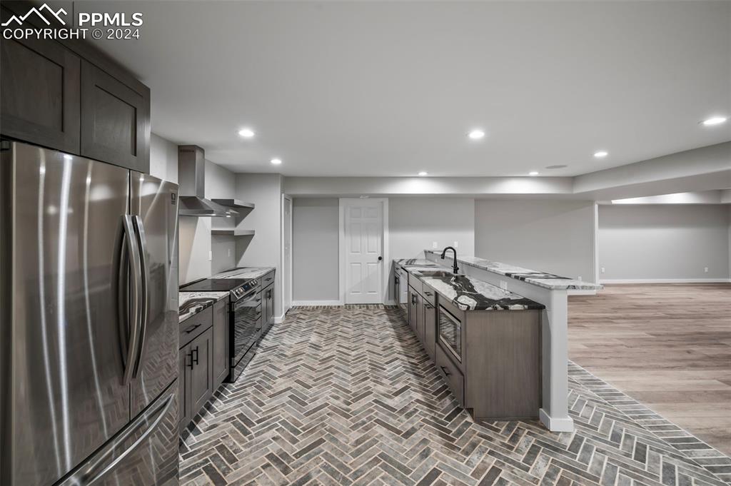 18775 Sweet Road Peyton, CO 80831 - Photo 35 of 50 a kitchen with stainless steel appliances granite countertop a refrigerator a stove and a refrigerator