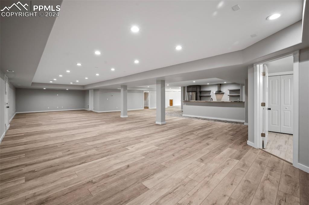 18775 Sweet Road Peyton, CO 80831 - Photo 36 of 50 an empty room with wooden floor and windows