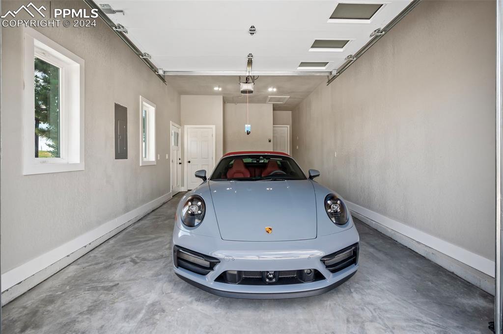 18775 Sweet Road Peyton, CO 80831 - Photo 45 of 50 a car parked in front of garage