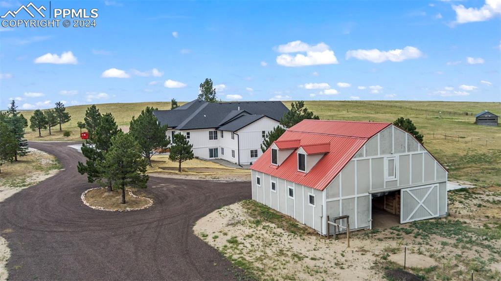 18775 Sweet Road Peyton, CO 80831 - Photo 46 of 50 a spacious bathroom with a sink and a mirror