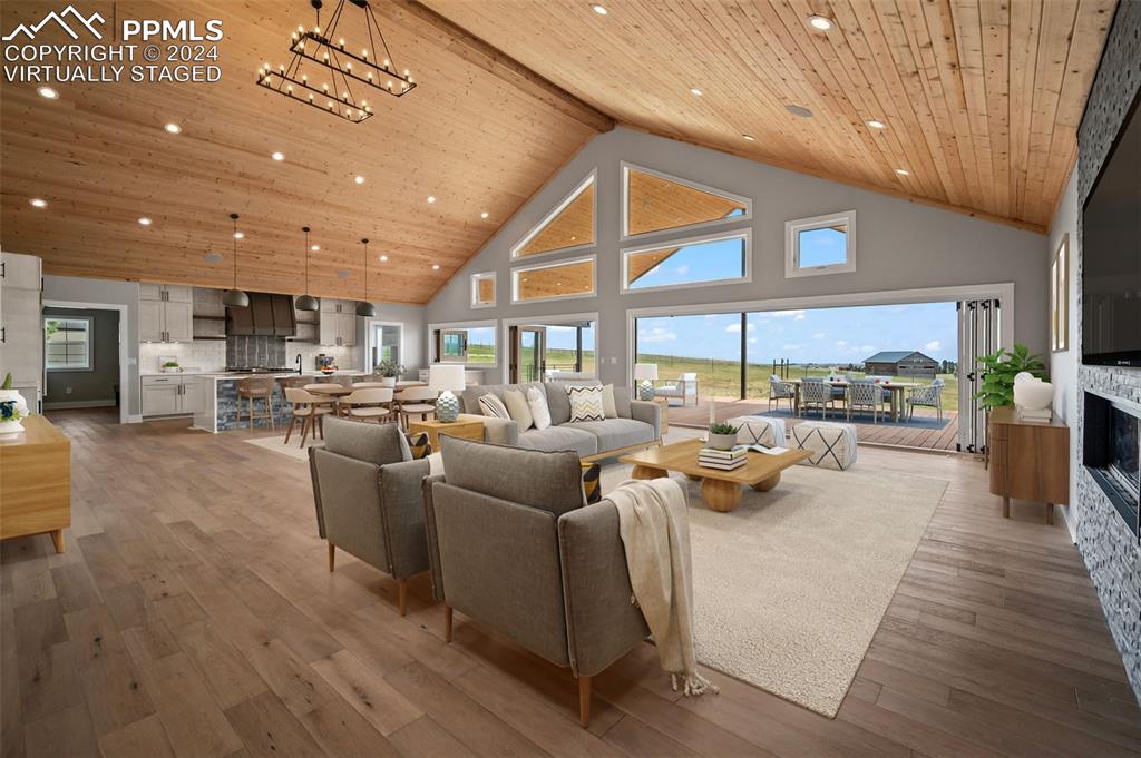18775 Sweet Road Peyton, CO 80831 - Photo 7 of 50 a living room with lots of furniture and a large window