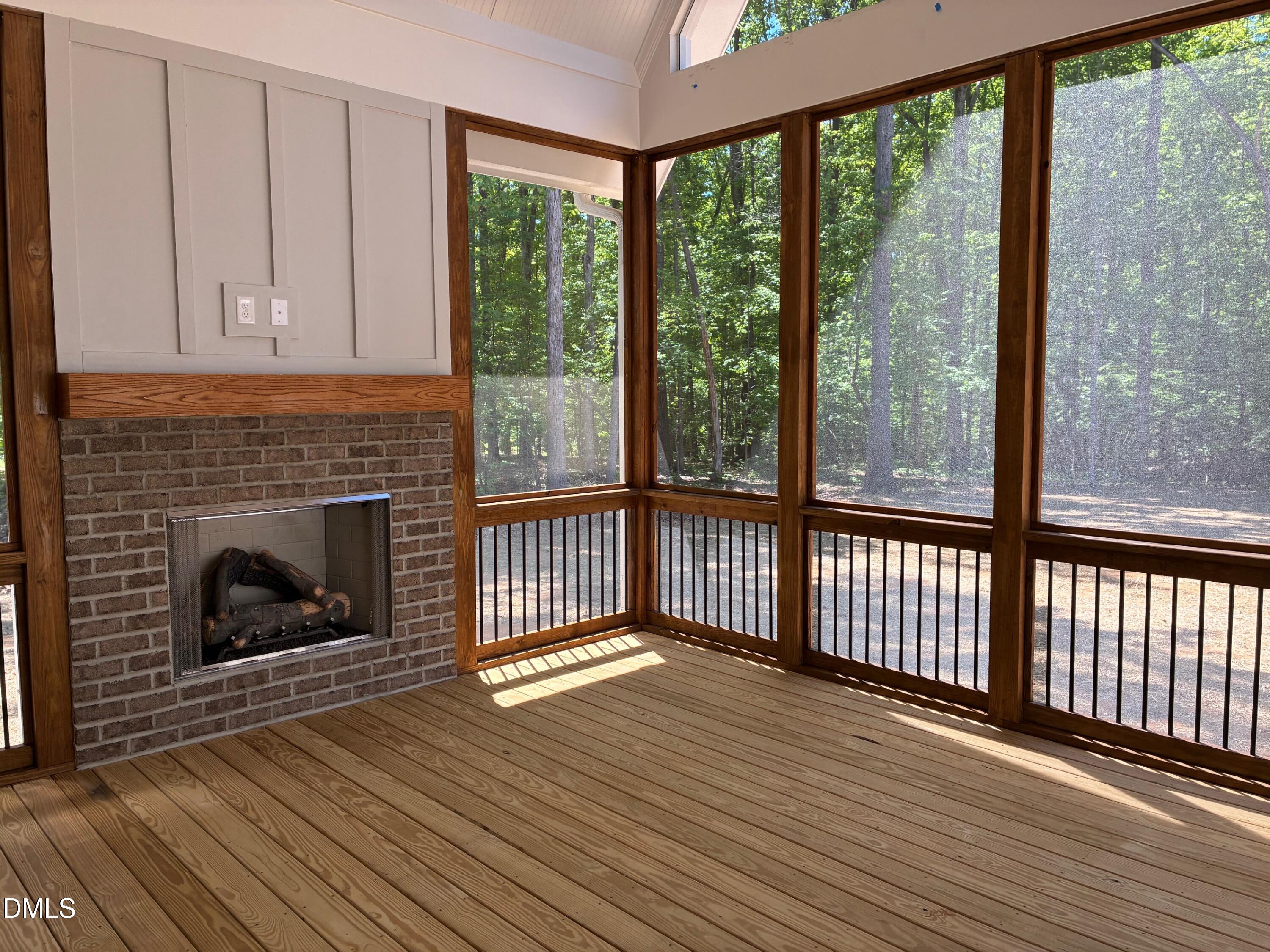 638 Old Goldston Road Pittsboro, NC 27312 - Photo 13 of 28 a view of a livingroom with wooden floor and a fireplace