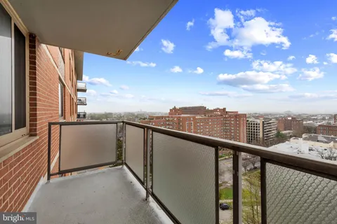 a view of a balcony with city view