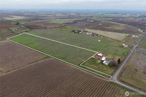 a aerial view of a house with a yard