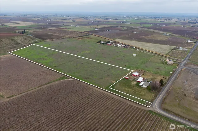 a aerial view of a house with a yard