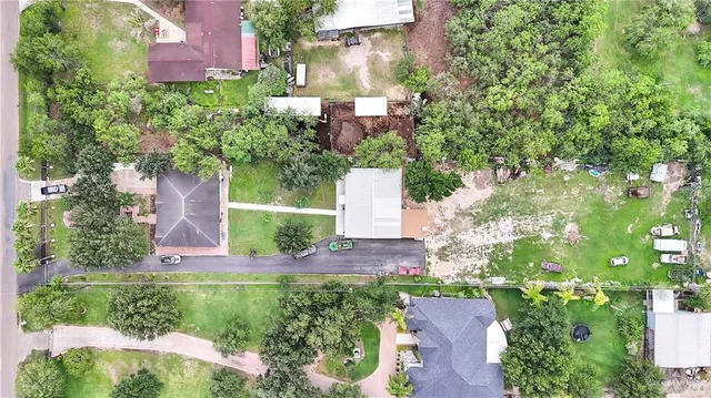 an aerial view of a house with a yard