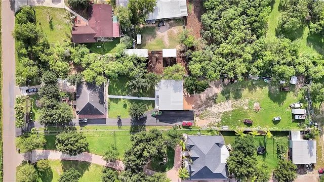 an aerial view of house with swimming pool