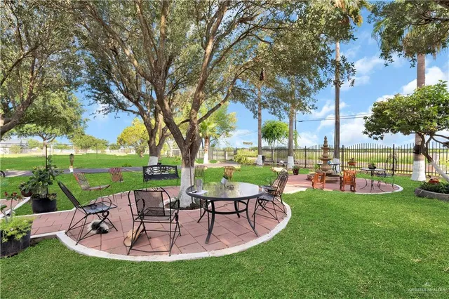 a view of a swimming pool and lounge chairs