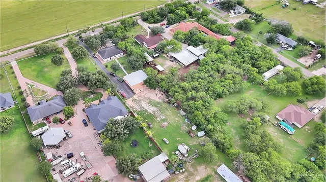 an aerial view of residential houses with outdoor space