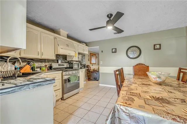 a kitchen with stainless steel appliances granite countertop a sink and cabinets