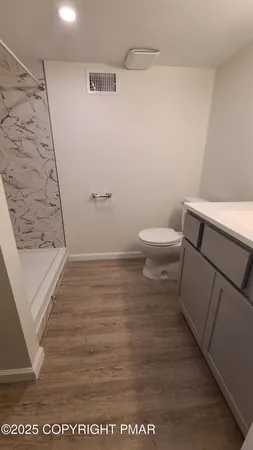 a bathroom with a sink and a toilet
