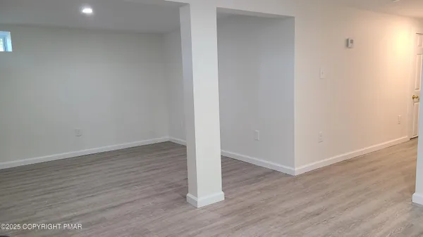 a view of wooden floor in an empty room