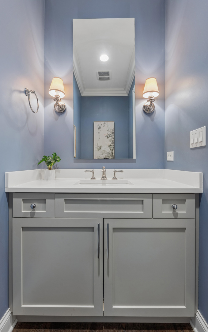 2740 North Seminary Avenue, Unit 1 Chicago, IL 60614 - Photo 14 of 46 a sink with a mirror and vanity