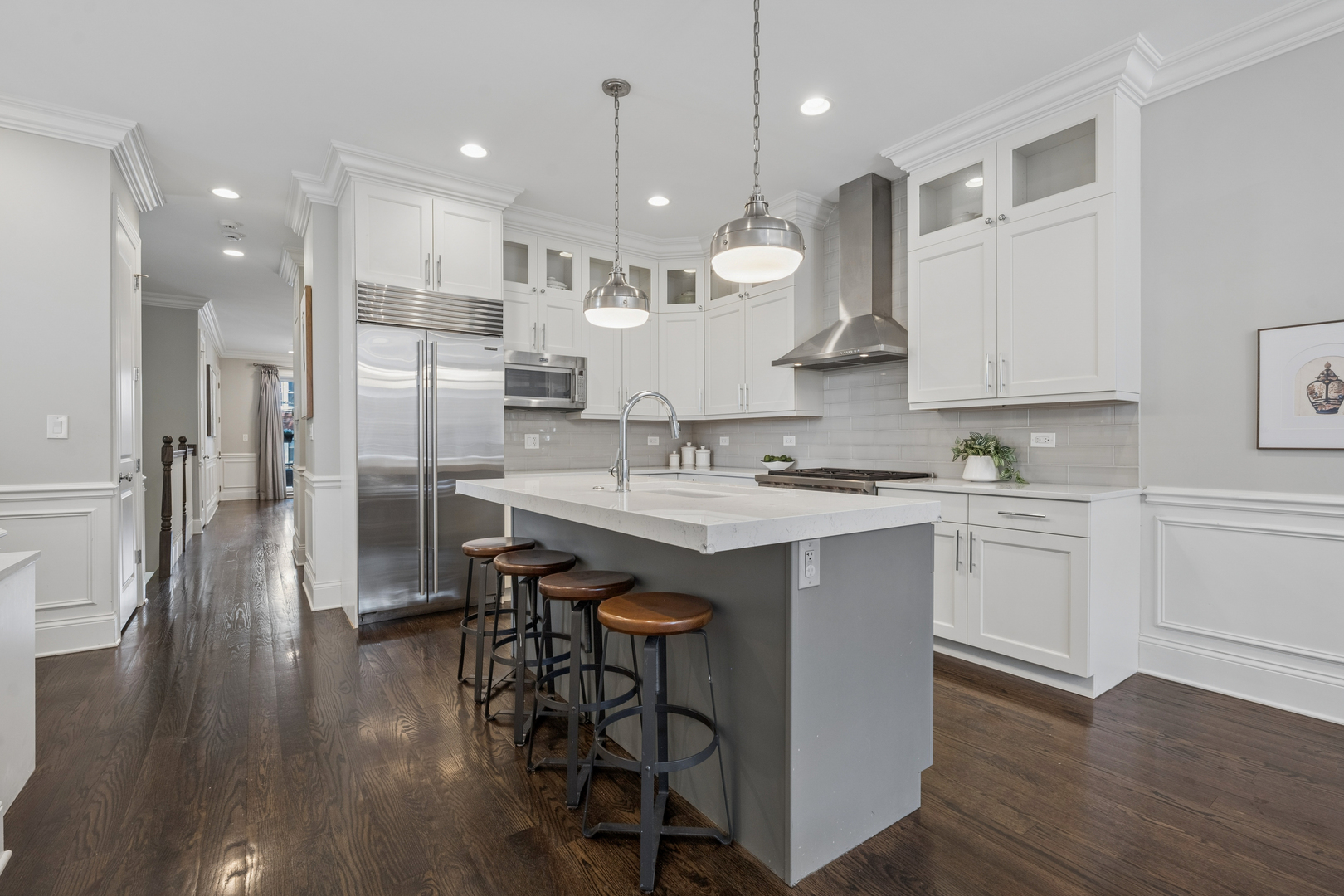 2740 North Seminary Avenue, Unit 1 Chicago, IL 60614 - Photo 22 of 46 a kitchen with a sink cabinets stainless steel appliances and wooden floor