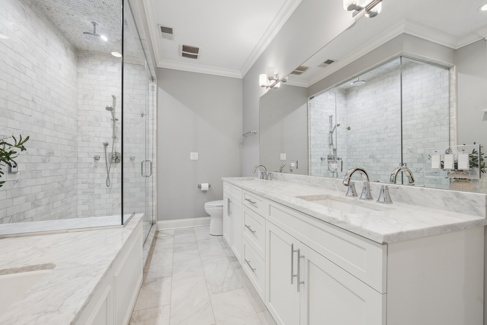 2740 North Seminary Avenue, Unit 1 Chicago, IL 60614 - Photo 37 of 46 a spacious bathroom with a double vanity sink mirror double and shower