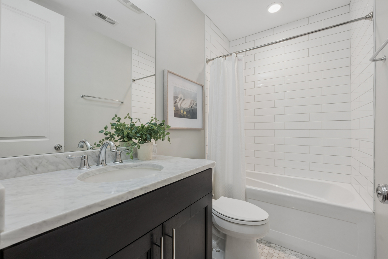 2740 North Seminary Avenue, Unit 1 Chicago, IL 60614 - Photo 43 of 46 a bathroom with a sink a toilet and shower