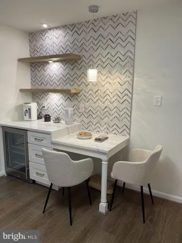 a kitchen with a table and chairs in it