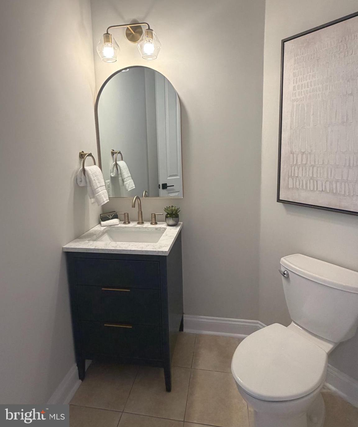 9153 Riesley Lane Vienna, VA 22182 - Photo 9 of 28 Renovated half bath on main level