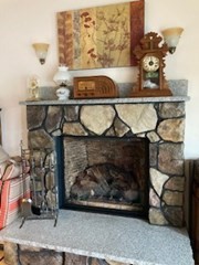 24 Indian Stone Road Phillipston, MA 01331 - Photo 5 of 21 a room with a fireplace and cabinets
