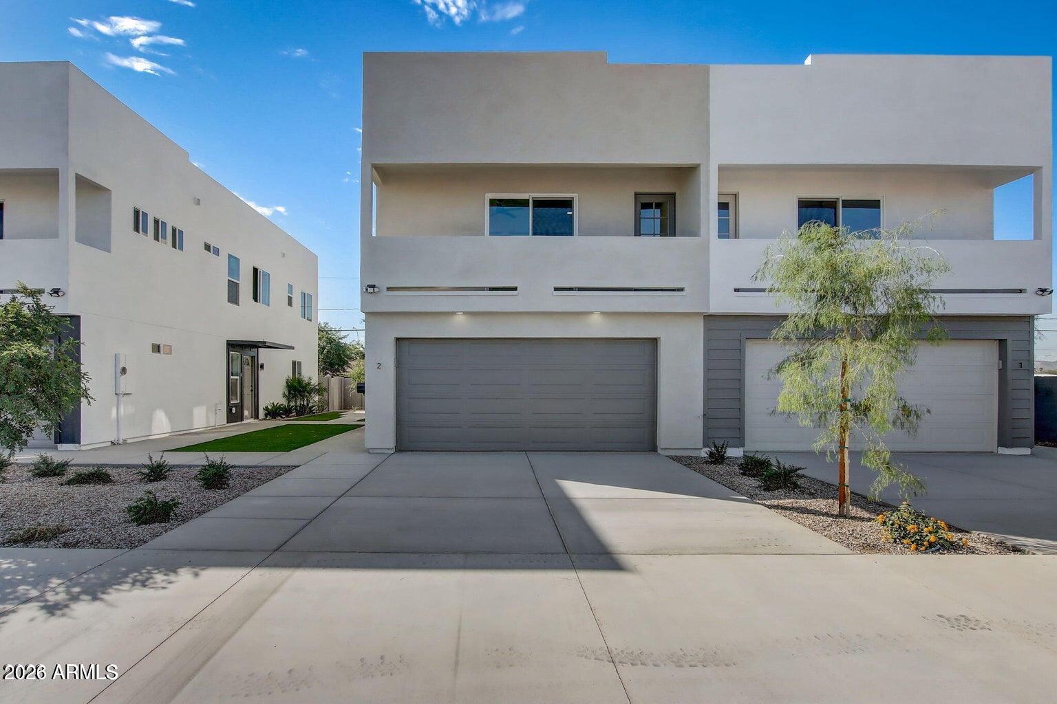 2509 East Broadway Road Phoenix, AZ 85040 - Photo 14 of 47 a front view of a house with yard