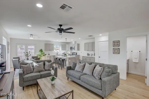 a living room with furniture and a large window