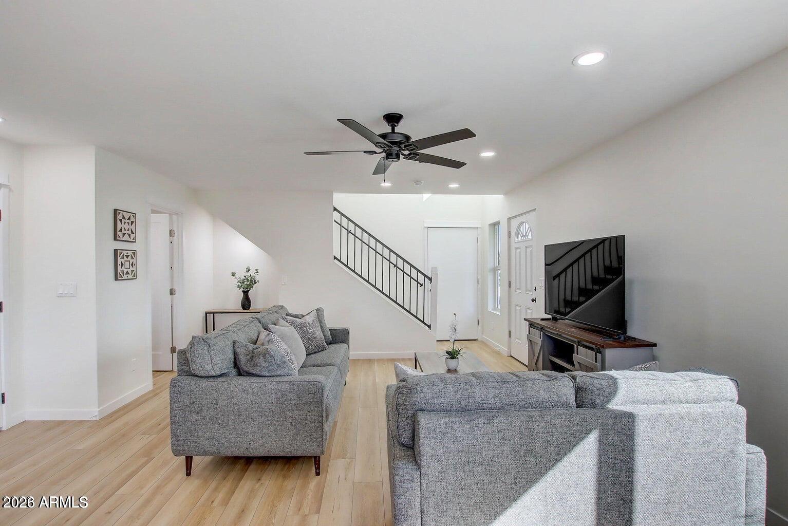 2509 East Broadway Road Phoenix, AZ 85040 - Photo 21 of 47 a living room with furniture and a flat screen tv