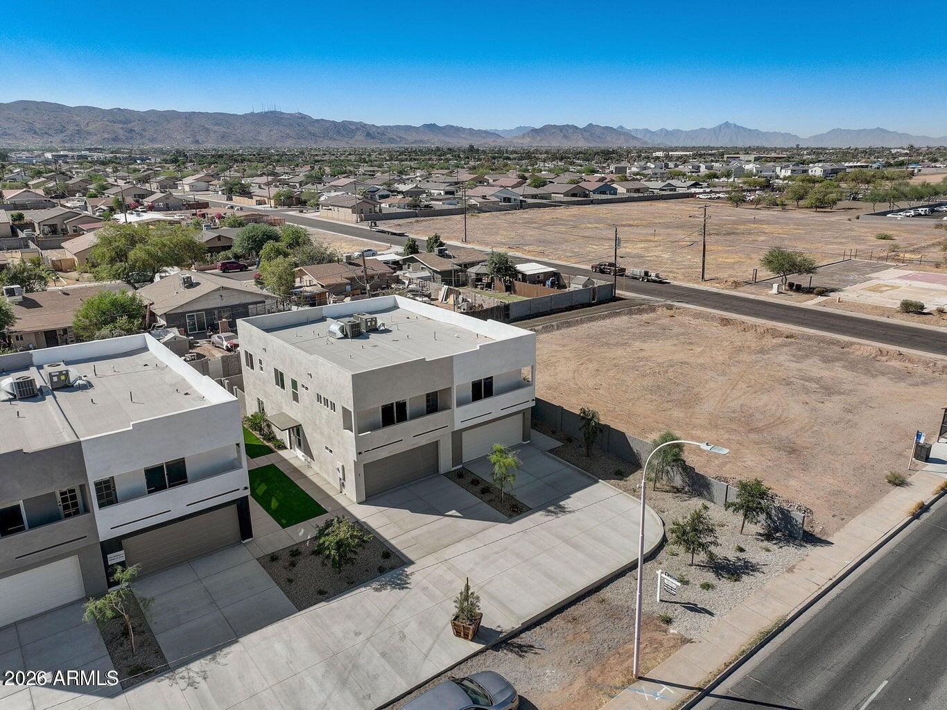 2509 East Broadway Road Phoenix, AZ 85040 - Photo 43 of 47 an aerial view of residential houses with outdoor space