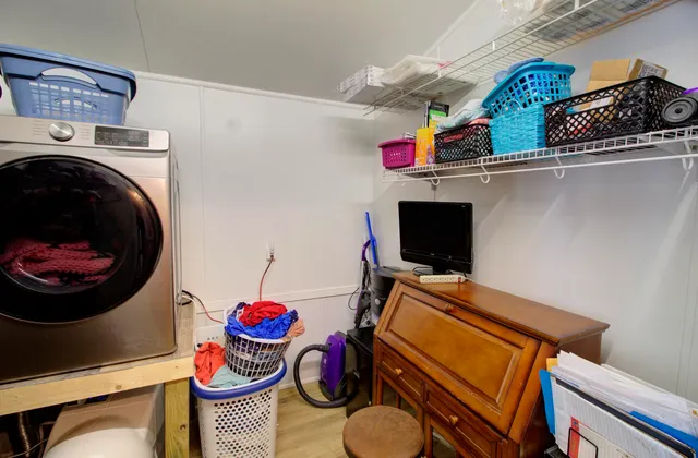 a room with furniture and wooden floor