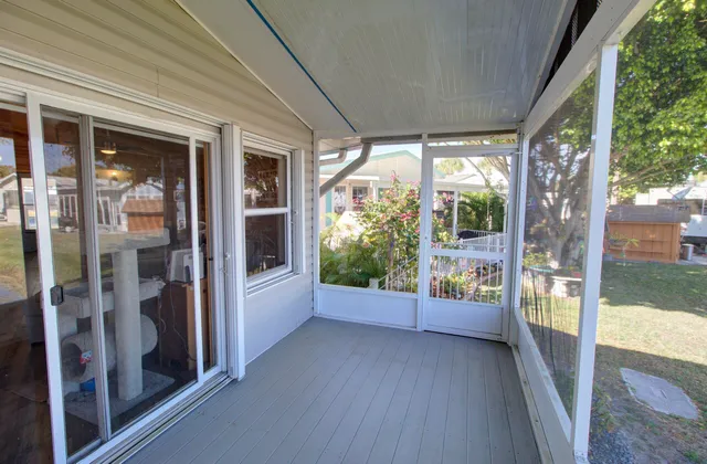 a view of a glass door with a balcony