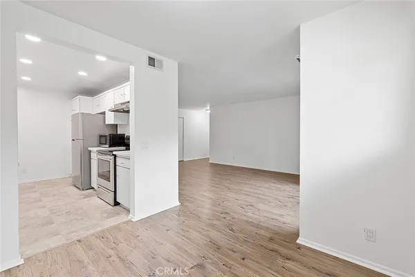 a view of kitchen and wooden floor