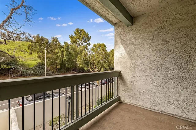a view of a balcony with a pot