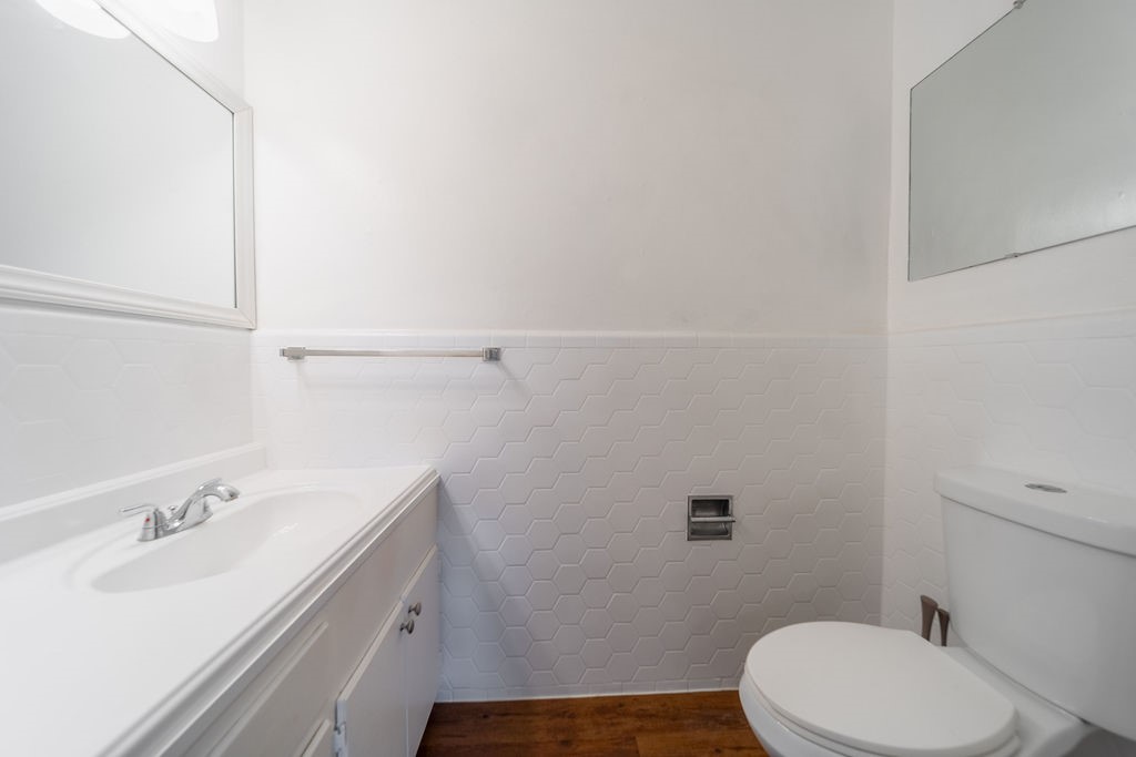 4723 Merwin Street Houston, TX 77027 - Photo 15 of 29 a bathroom with a sink mirror vanity and toilet